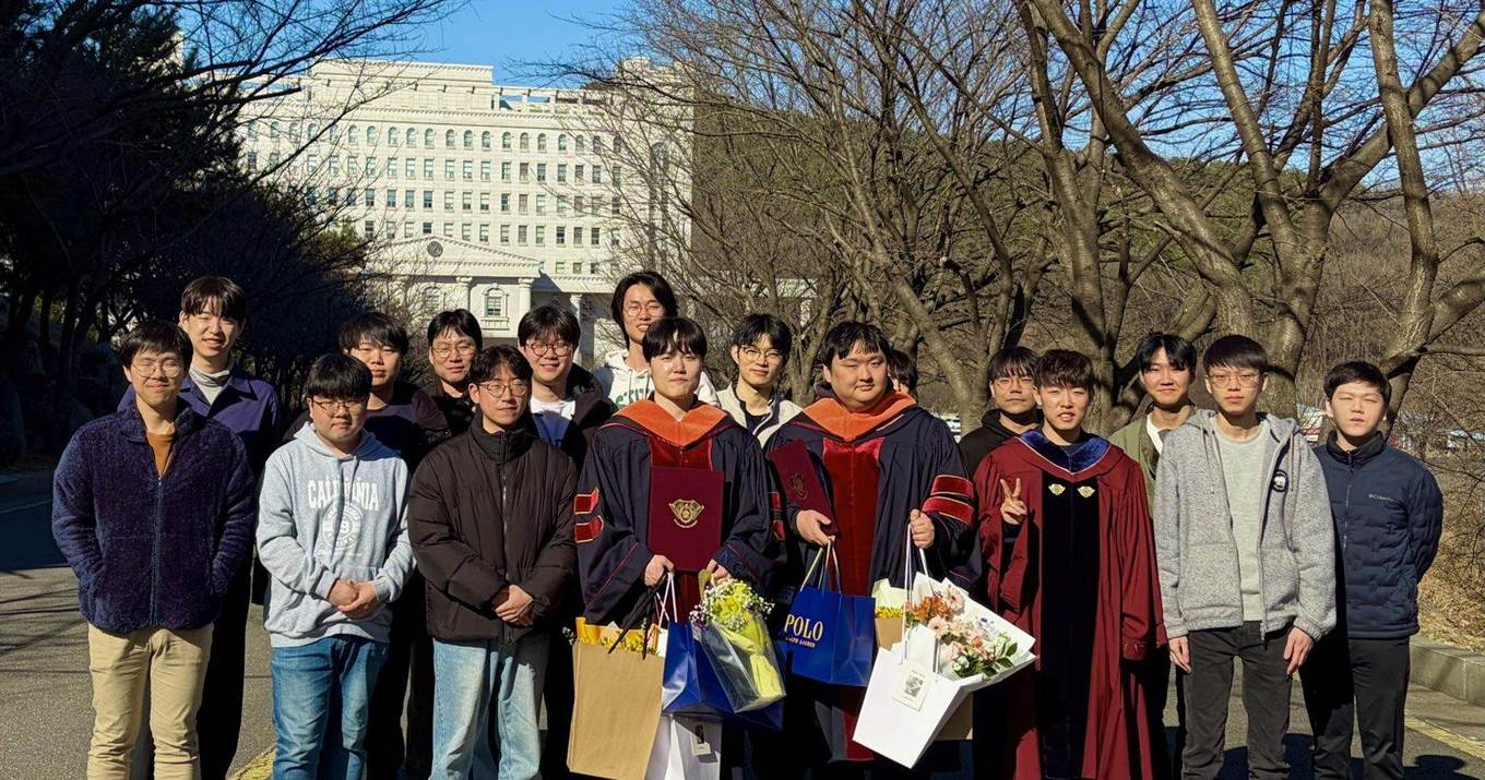 AIR Lab members in front of a Kyung Hee University building